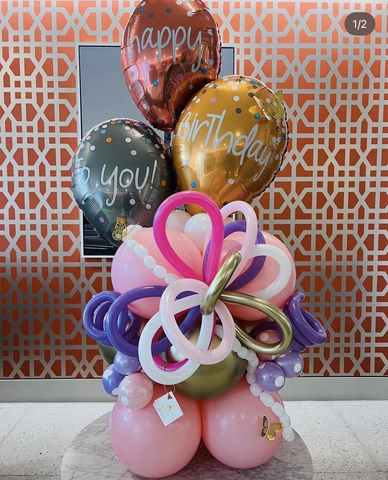 Pink, purple and gold birthday balloon arrangement