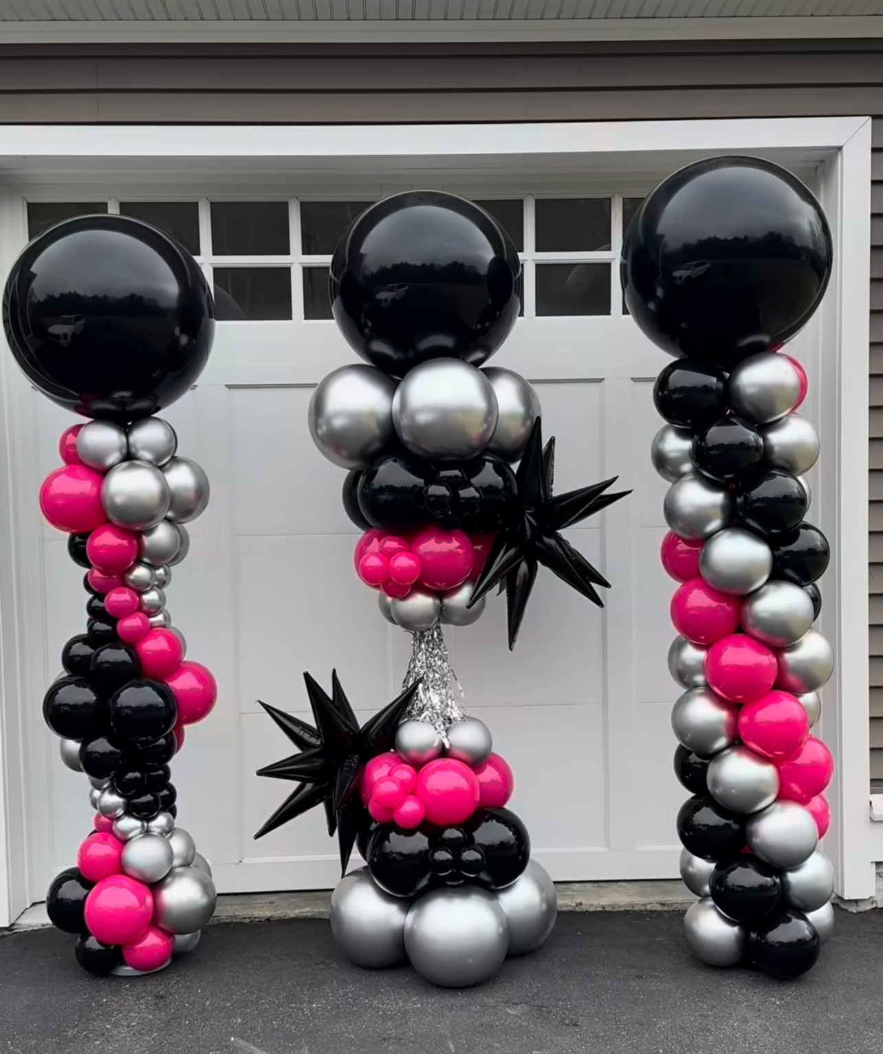 Black, silver and pink balloon columns and centerpiece